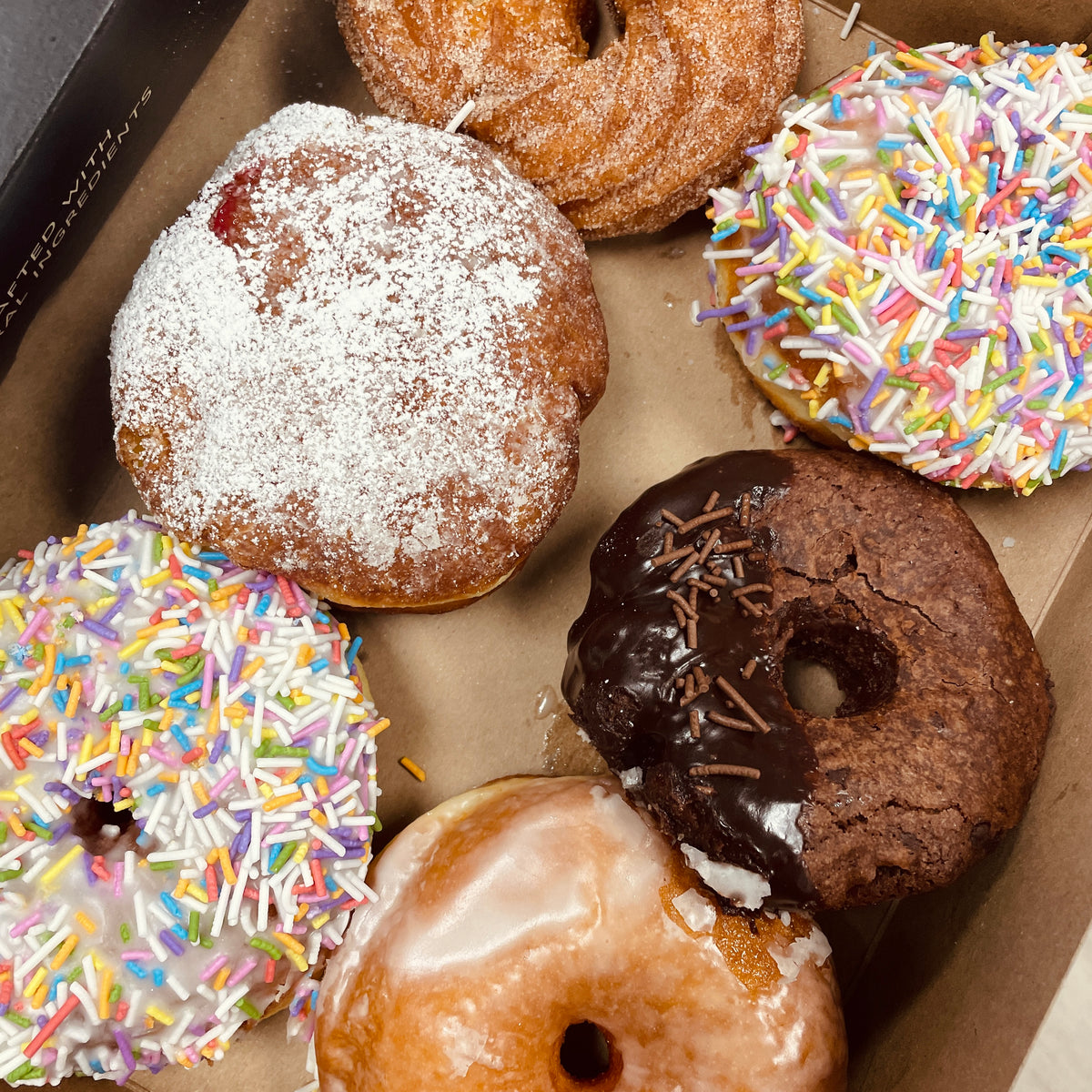 box of all natural handcrafted doughnuts that are perfect for kids birthday parties or celebrations niagara bakery