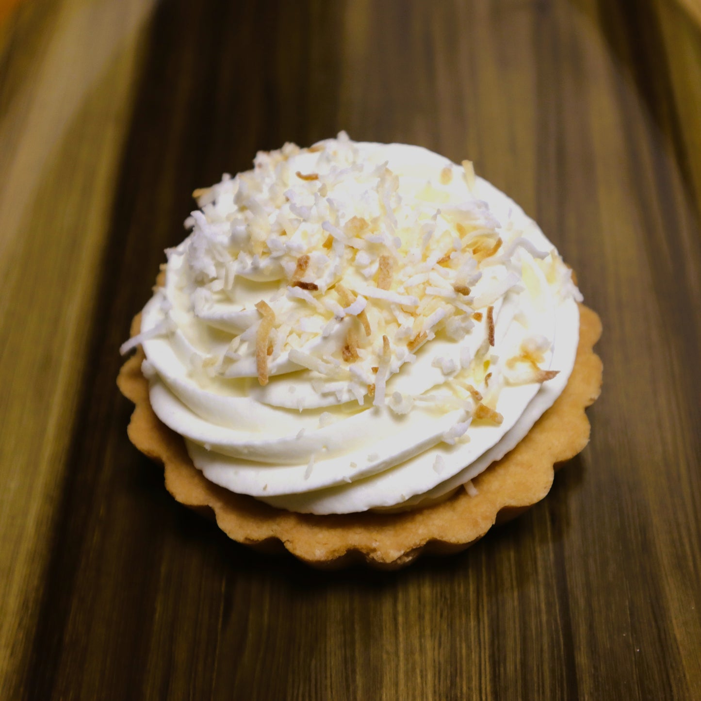 Artisan shortbread crust tart filled with handcrafted coconut cream filling, topped with real whipped cream and toasted coconut, Bakery St. Catharines